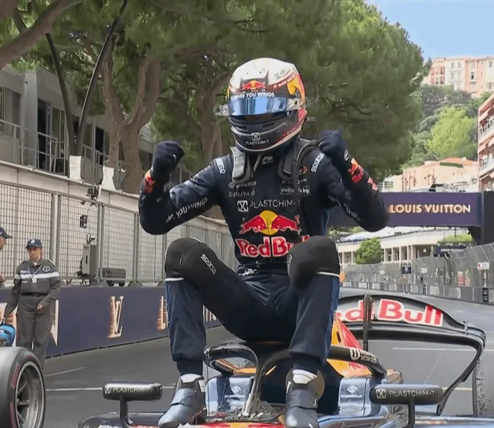 Nikola Tsolov celebrating on his Campos Racing car in parc fermé at the Monaco round of the 2026 season